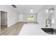Open living room with sleek floors and lots of natural light at 13505 Sw 112 Pl, Dunnellon, FL 34432