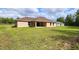 Spacious backyard with covered patio on a single-story home at 15407 Sw 59Th Avenue Rd, Ocala, FL 34473