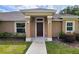 Inviting front entrance with decorative pillars and manicured landscaping at 15407 Sw 59Th Avenue Rd, Ocala, FL 34473