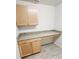 Bright home office features custom built-in desk area with granite countertop and modern wooden cabinets at 15407 Sw 59Th Avenue Rd, Ocala, FL 34473