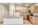 Bright kitchen featuring granite countertops, wood cabinets, and stainless steel appliances at 15407 Sw 59Th Avenue Rd, Ocala, FL 34473