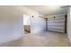 Spacious garage with concrete floor, door, and kitchen view, perfect for parking and storage at 1610 Sw 152Nd Ct, Ocala, FL 34481