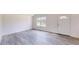 Cozy living area with ample natural light and sleek, modern flooring at 1610 Sw 152Nd Ct, Ocala, FL 34481