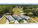 Aerial view of the property showcasing its location on a golf course with lush green surroundings at 17505 Se 100Th Ct, Summerfield, FL 34491
