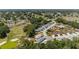 Panoramic aerial view of a peaceful community nestled amidst lush greenery and a scenic golf course at 17505 Se 100Th Ct, Summerfield, FL 34491