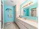 This bathroom features a vanity with ample counter space and built-in storage below the counter at 17505 Se 100Th Ct, Summerfield, FL 34491