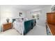 Cozy bedroom with white carpet, soft natural light, and classic furniture, creating a restful atmosphere at 17505 Se 100Th Ct, Summerfield, FL 34491
