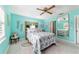 This bedroom offers calming light-blue walls and a ceiling fan for added comfort and air circulation at 17505 Se 100Th Ct, Summerfield, FL 34491