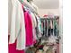 Walk-in closet that is well-organized, with clothing and shoes neatly arranged for easy access and space efficiency at 17505 Se 100Th Ct, Summerfield, FL 34491
