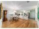 Open floorplan with dining area leading to kitchen and entrance at 17505 Se 100Th Ct, Summerfield, FL 34491