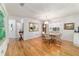Dining room featuring hardwood floors, ample sunlight, and a neutral color scheme at 17505 Se 100Th Ct, Summerfield, FL 34491