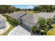 Charming single-story home featuring a well-manicured lawn and an attached two-car garage at 17505 Se 100Th Ct, Summerfield, FL 34491