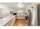 Kitchen features stainless steel appliances and view to dining area at 17505 Se 100Th Ct, Summerfield, FL 34491