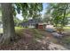 Full view of backyard, showcasing the screened-in pool and adjacent smaller pool at 1781 Se 85Th Street Rd, Ocala, FL 34480