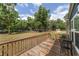 Spacious backyard deck perfect for outdoor seating, with a view of the lush lawn at 1781 Se 85Th Street Rd, Ocala, FL 34480