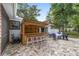 Outdoor bar with seating overlooking the paver patio and backyard at 1781 Se 85Th Street Rd, Ocala, FL 34480