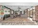 Relax on this brick-paved covered patio with lounge, dining, and bar areas perfect for entertaining friends at 1781 Se 85Th Street Rd, Ocala, FL 34480