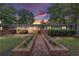 Charming single-story brick home featuring a landscaped front yard, brick planter, and inviting entrance with a wood door at 1781 Se 85Th Street Rd, Ocala, FL 34480