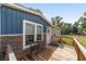 Inviting front porch area featuring a small seating area, and a view of the front yard at 1781 Se 85Th Street Rd, Ocala, FL 34480