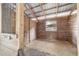 A bright and airy horse stall with wood paneling, a metal roof, and a grated window offering ventilation at 1781 Se 85Th Street Rd, Ocala, FL 34480