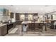 Charming kitchen featuring an eat-in island, stainless steel appliances, and dark wood cabinets at 1781 Se 85Th Street Rd, Ocala, FL 34480