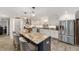 Gourmet kitchen featuring a large island and white cabinetry at 1781 Se 85Th Street Rd, Ocala, FL 34480