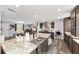 Open-concept kitchen featuring a large island, sink, and adjacent living area at 1781 Se 85Th Street Rd, Ocala, FL 34480