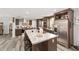 Gourmet kitchen with a large island, stainless steel appliances, and custom cabinetry at 1781 Se 85Th Street Rd, Ocala, FL 34480