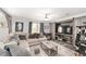 Comfortable living room offering a large couch, natural light, and a wood entertainment center at 1781 Se 85Th Street Rd, Ocala, FL 34480