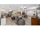 Expansive living room with dining space, modern kitchen, and tile flooring ideal for entertaining or relaxed living at 1781 Se 85Th Street Rd, Ocala, FL 34480