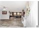 Open-concept living room and kitchen with modern flooring, fixtures, and lots of natural light at 1781 Se 85Th Street Rd, Ocala, FL 34480