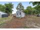 Small outbuilding with stairs and a small adjacent storage shed at 1781 Se 85Th Street Rd, Ocala, FL 34480
