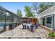 Stone patio with outdoor bar, outdoor kitchen, and multiple seating areas at 1781 Se 85Th Street Rd, Ocala, FL 34480