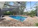 Enjoy the screened-in pool area with beautiful brick paving and ample space for relaxing or entertaining at 1781 Se 85Th Street Rd, Ocala, FL 34480