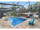 Relaxing screened-in pool area with a patio, outdoor seating, and views of the surrounding landscape at 1781 Se 85Th Street Rd, Ocala, FL 34480