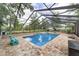 Relaxing screened-in pool with brick pavers and outdoor seating at 1781 Se 85Th Street Rd, Ocala, FL 34480