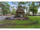 Cozy shed nestled in a serene backyard, featuring a charming porch and garden, ideal for relaxing at 1781 Se 85Th Street Rd, Ocala, FL 34480