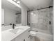 Modern bathroom with marble-style shower, sleek vanity, and black fixtures at 20751 Sw Cardinal Ave, Dunnellon, FL 34431