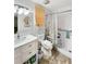 Bathroom with white vanity, large mirror, and shower with accessibility features at 2340 Ne 44Th St, Ocala, FL 34479