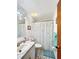 Bathroom featuring vanity with marbled countertops, a large mirror, and a shower with a fun, star-themed curtain at 2340 Ne 44Th St, Ocala, FL 34479