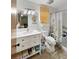 Bathroom with white vanity, large mirror, and shower with a floral curtain and accessibility features at 2340 Ne 44Th St, Ocala, FL 34479