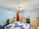 Cozy bedroom featuring a bed, ceiling fan, and neutral-toned decor at 2340 Ne 44Th St, Ocala, FL 34479