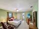 The main bedroom features an ensuite bathroom, a spacious closet, and natural light at 2340 Ne 44Th St, Ocala, FL 34479