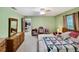 The main bedroom features an ensuite bathroom, a spacious closet, and natural light at 2340 Ne 44Th St, Ocala, FL 34479