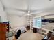 Bedroom featuring a bed, ceiling fan, built-in shelving, and a window with natural light at 2340 Ne 44Th St, Ocala, FL 34479