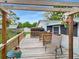 Inviting outdoor deck area offers a relaxing space with a pergola and view of the backyard, perfect for enjoying the outdoors at 2340 Ne 44Th St, Ocala, FL 34479