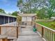 Outdoor deck with a pergola provides a shaded seating area, enhancing outdoor living and relaxation in a serene backyard setting at 2340 Ne 44Th St, Ocala, FL 34479