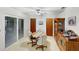 Bright dining area featuring a ceiling fan, sliding glass door, and lots of storage at 2340 Ne 44Th St, Ocala, FL 34479