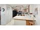 The kitchen features stainless appliances, wood cabinetry, and laminate countertops at 2340 Ne 44Th St, Ocala, FL 34479