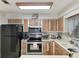 The kitchen features stainless appliances, wood cabinetry, and laminate countertops at 2340 Ne 44Th St, Ocala, FL 34479